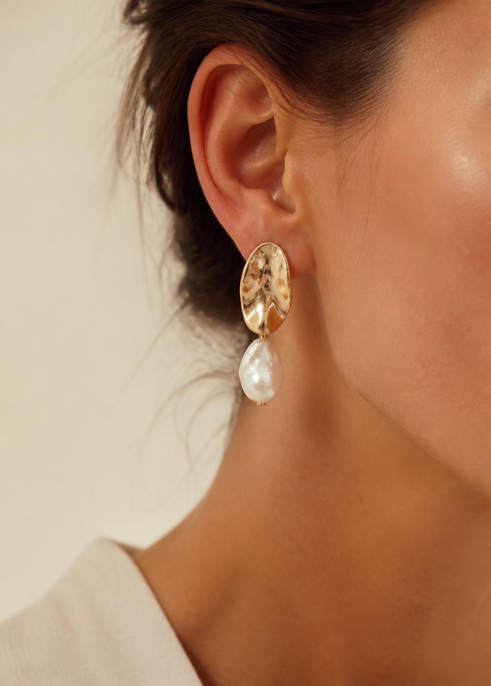 LUEL sculptural gold and pearl earring worn